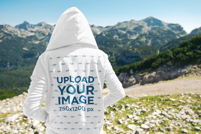 Travel Mockup Featuring a Man in the Mountains with a Hoodie
