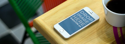 Mockup of a Gold iPhone 5S on a Restaurant Table