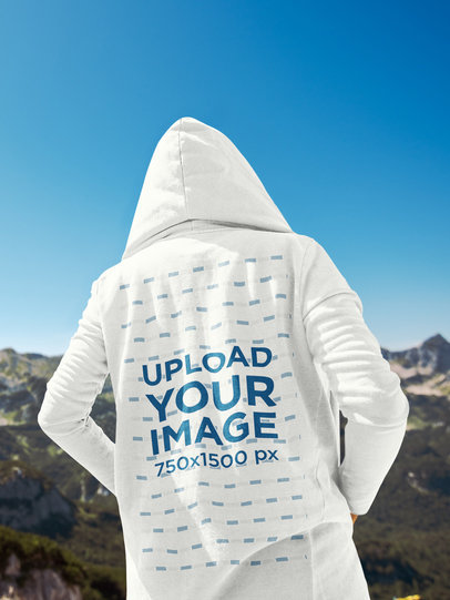 Back View Mockup of a Man with a Hoodie Looking at the Mountains 