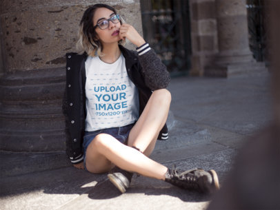 Hipster Hispanic Woman Wearing a Round Neck Tee While Sitting Down Outdoors Mockup