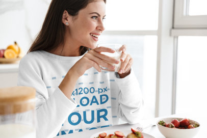 Crewneck Sweatshirt Mockup of a Smiling Woman Eating Breakfast