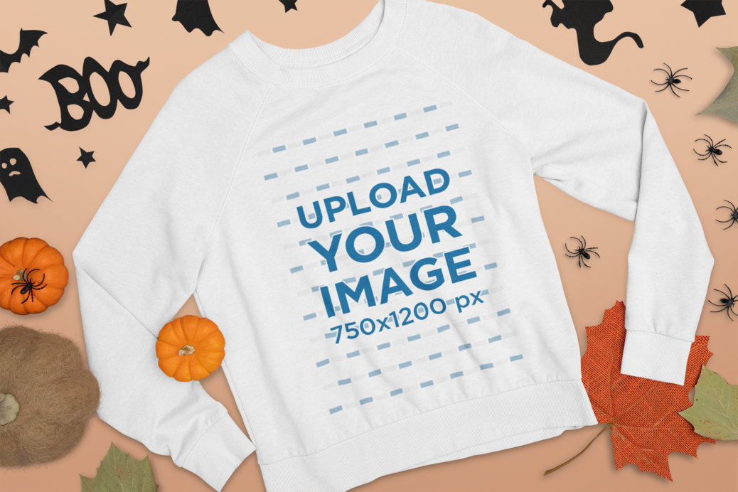 Mockup of a Flat Laid Crewneck Sweatshirt Surrounded by Halloween Decor 