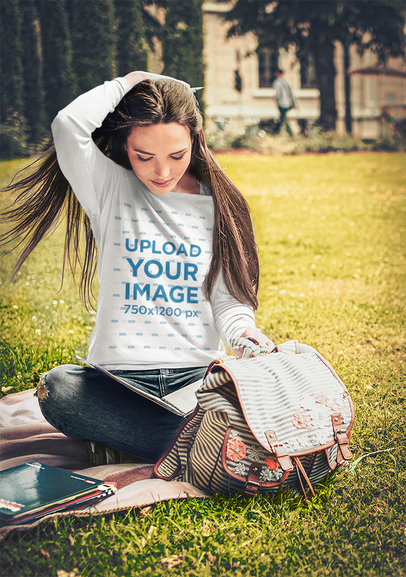 Sweatshirt Mockup of a Student Sitting on the Grass