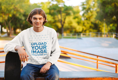 Crewneck Sweatshirt Mockup Featuring a Young Man at a Skatepark 