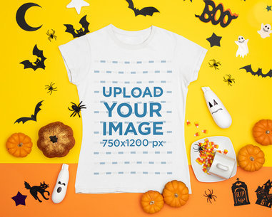 Halloween-Themed Mockup Featuring a T-Shirt Placed Among Spooky Decorations 