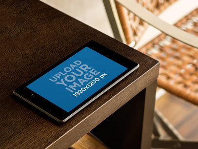 Mockup of a Nexus 7 at the Edge of a Brown Table