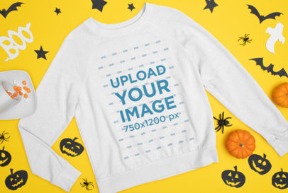 Mockup of a Flat Laid Sweatshirt Featuring Halloween Decorations m87