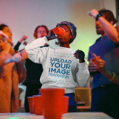 Sweatshirt Mockup of a Woman Playing Beer Pong at a Party