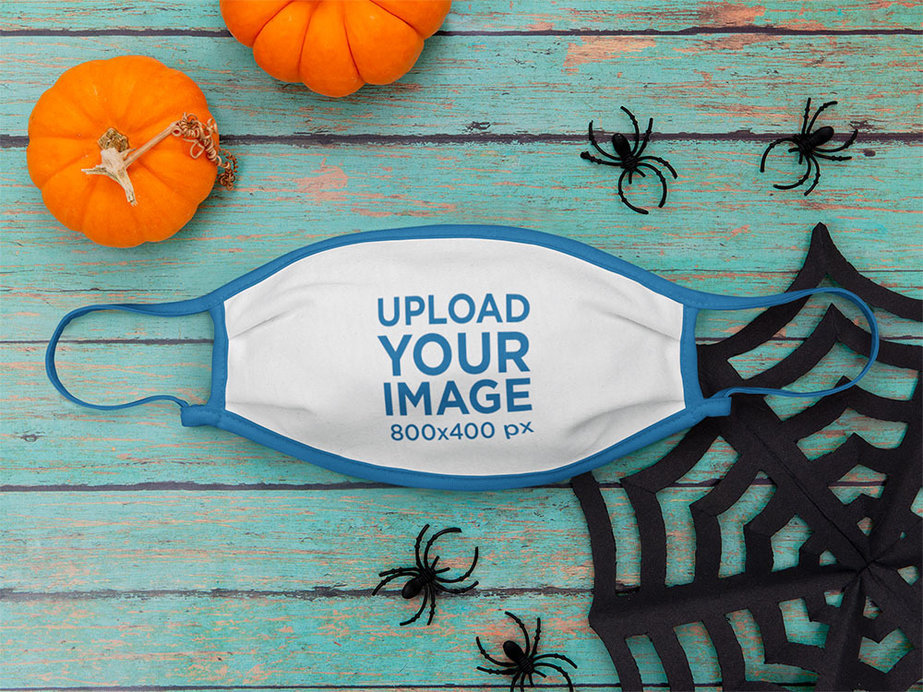 Mockup of a Face Mask Surrounded by Halloween Decor 