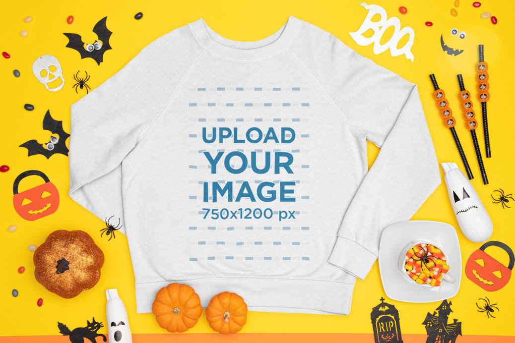 Mockup of a Crewneck Sweatshirt Surrounded by Halloween Decorations