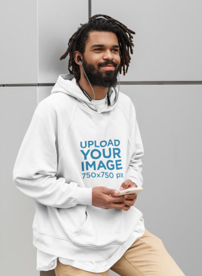 Hoodie Mockup of a Bearded Man Listening to Music