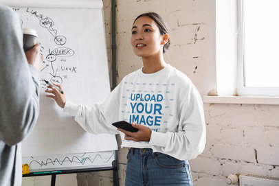 Sweatshirt Mockup of a Woman Giving a Presentation