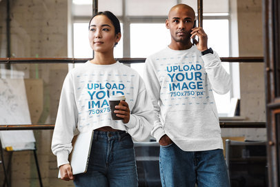Mockup of a Woman and a Man Wearing Sweatshirts at Work
