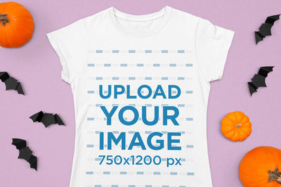 Mockup of a Women's T-Shirt Flat Laid in a Halloween Setting