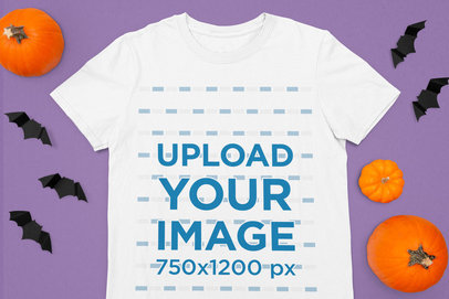 Halloween-Themed Mockup Featuring a T-Shirt Surrounded by Pumpkins