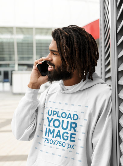 Hoodie Mockup Featuring a Happy Man Making a Phone Call 
