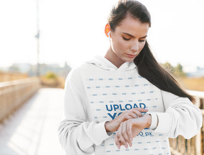 Mockup of a Serious Woman Wearing a Customizable Oversized Hoodie 