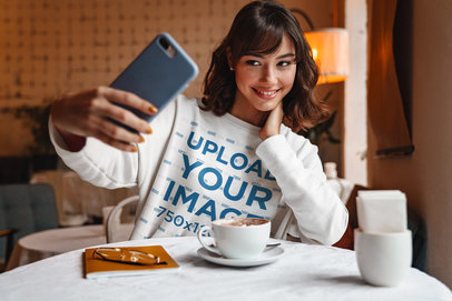 Crewneck Sweatshirt Mockup Featuring a Woman Taking a Selfie