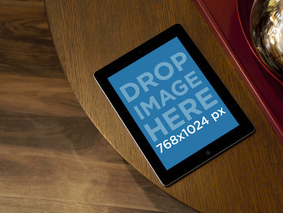 iPad Mockup Featuring a Wooden Home Table 