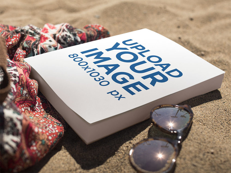 Book Lying on the Beach Near Sunglasses and a Skirt Mockup