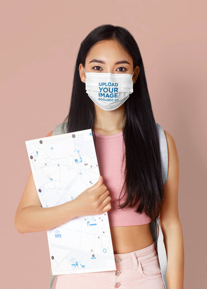 Mockup of a Female Student Wearing a Face Mask in a Studio
