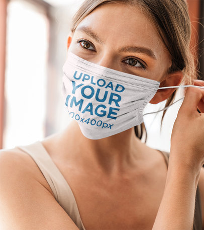 Mockup of a Woman Putting On a Face Mask