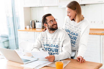 Sweatshirt Mockup Featuring a Couple at Home