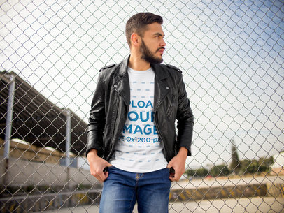 Young Hispanic Man Wearing a T-Shirt While Looking at an Industrial Area Outside of the City