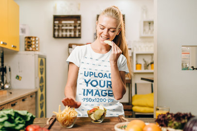 Basic T-Shirt Mockup of a Young Woman Making Dinner 