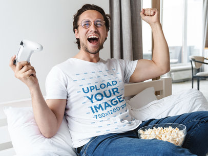 T-Shirt Mockup of a Gamer Celebrating a Victory