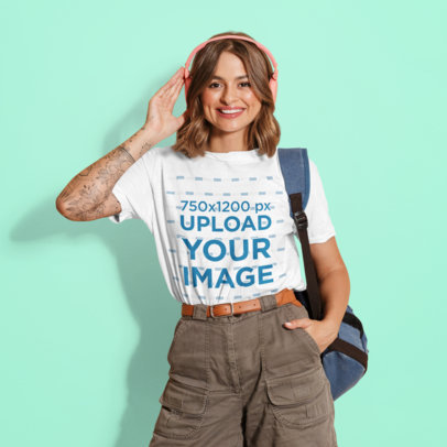 T-Shirt Mockup of a Tattooed Woman Wearing Headphones in a Studio