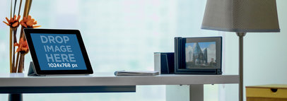 Mockup of an iPad Placed in Landscape Position over a Business Table 