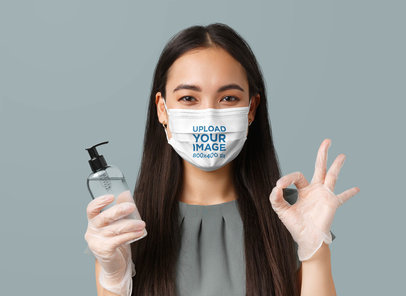 Face Mask Mockup of a Woman Holding a Bottle of Sanitizer 42852-r-el2