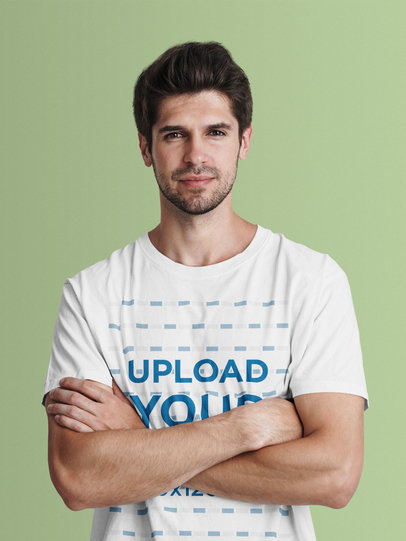 Studio Mockup of a Man in a T-Shirt Posing with Crossed Arms