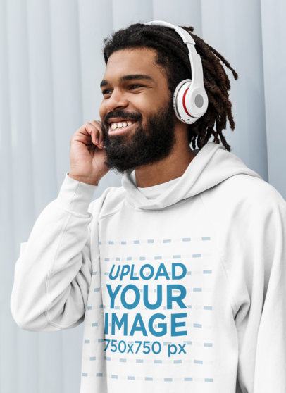 Pullover Hoodie Mockup of a Man Listening to Music on His Headphones