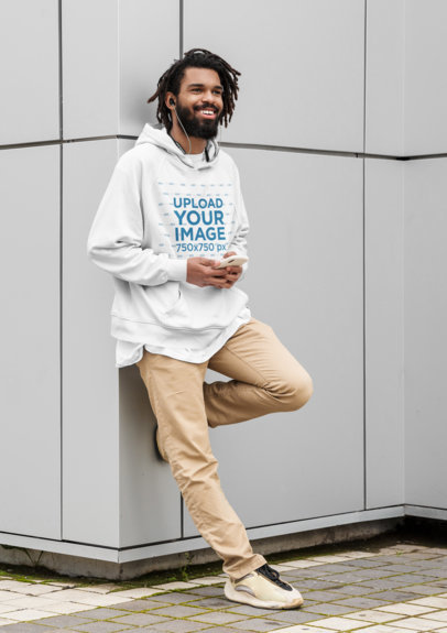 Hoodie Mockup of a Cool Man Leaning on a Wall