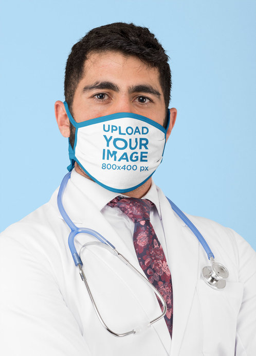 Placeit - Mockup of a Doctor Wearing a Sublimated Face Mask at a Studio