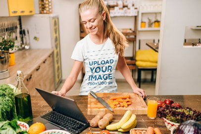 Crew Neck T-Shirt Mockup Featuring a Happy Woman Cooking at Home 