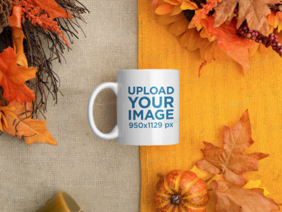 Mockup of an 11 oz Mug Surrounded by Autumn Leaves m62