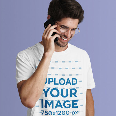 T-Shirt Mockup Featuring a Man on the Phone in a Studio