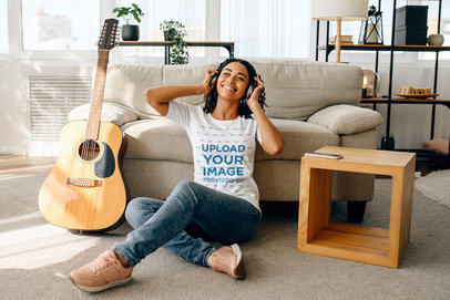 T-Shirt Mockup of a Woman Sitting Next to a Guitar