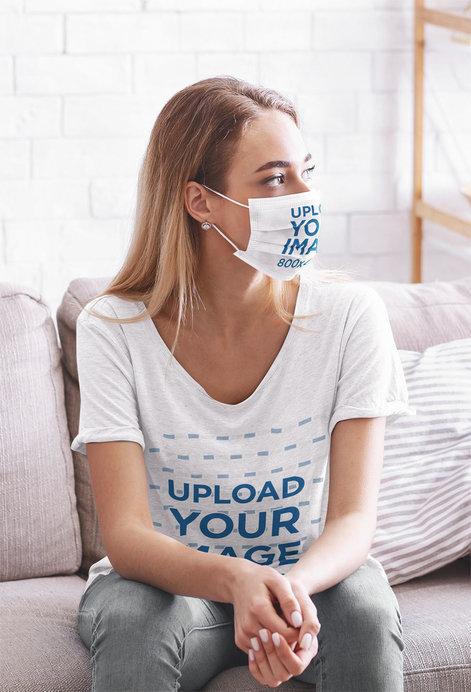 T-Shirt and Face Mask Mockup of a Woman Sitting at Home