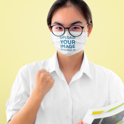 Face Mask Mockup of an Encouraging Woman in a Studio 