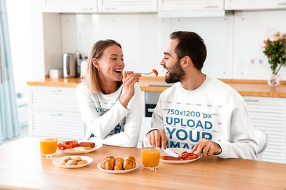 Sweatshirt Mockup of a Couple Having Breakfast Together 