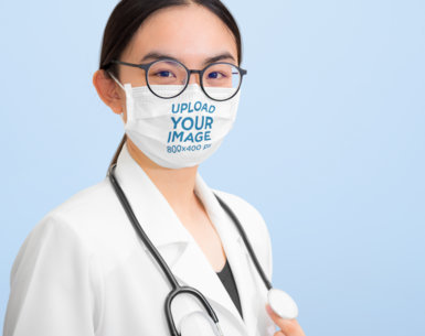 Face Mask Mockup Featuring a Young Female Doctor 