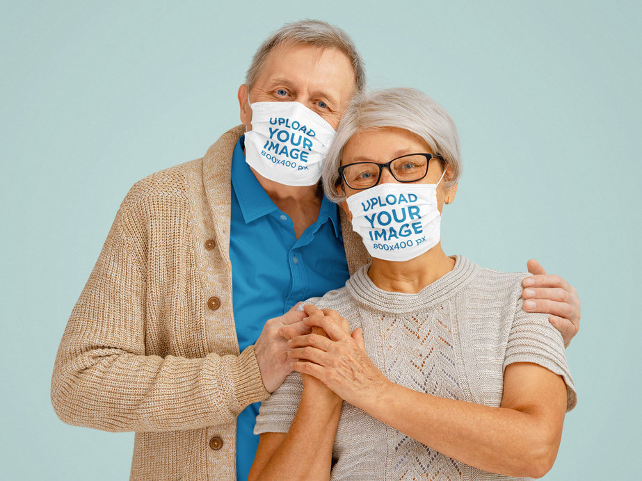 Mockup of a Senior Couple Wearing Face Masks in a Studio