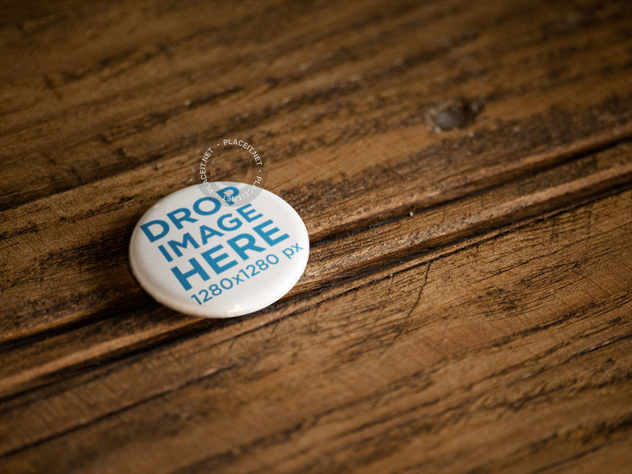 Placeit - Button Lying on a Wooden Surface Mockup