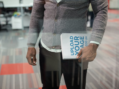 Man Holding a Book While Standing in the Other Side of the Window Mockup