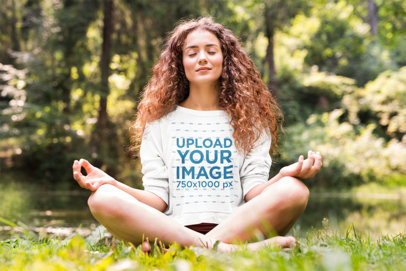 Sweatshirt Mockup of a Happy Woman Meditating in a Garden