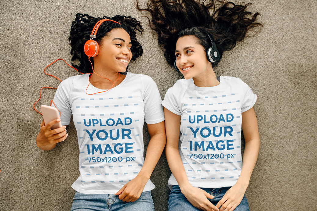 T-Shirt Mockup Featuring Two Women Listening to Music While Lying on the Floor 